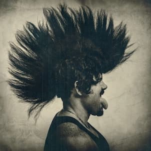 Punk side profile portrait with dramatic mohawk hairstyle